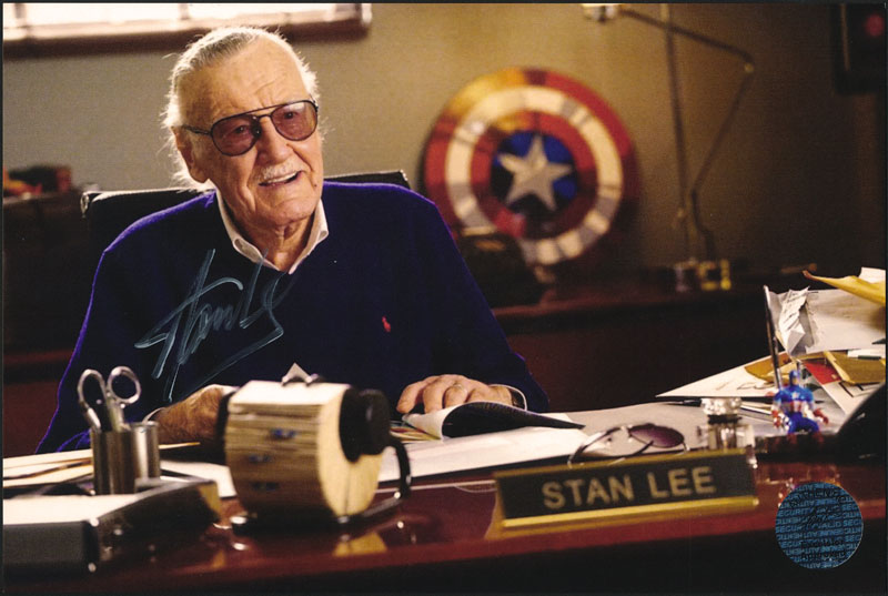 Stan Lee at Desk with Captain America Shield Autographed Photo